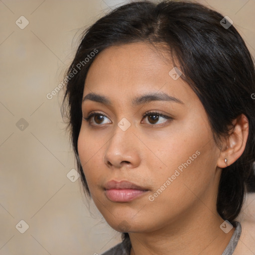 Neutral asian young-adult female with medium  brown hair and brown eyes