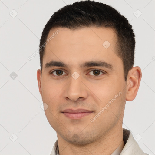 Joyful white young-adult male with short  brown hair and brown eyes