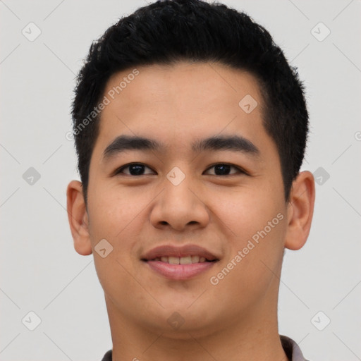 Joyful asian young-adult male with short  black hair and brown eyes