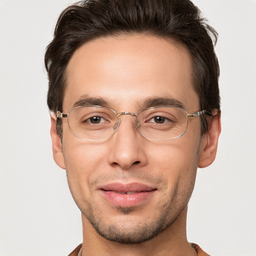 Joyful white adult male with short  brown hair and brown eyes