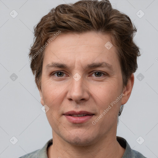 Joyful white adult male with short  brown hair and grey eyes