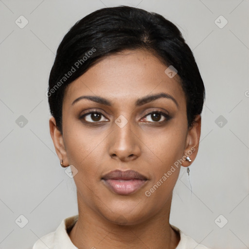 Joyful latino young-adult female with short  black hair and brown eyes