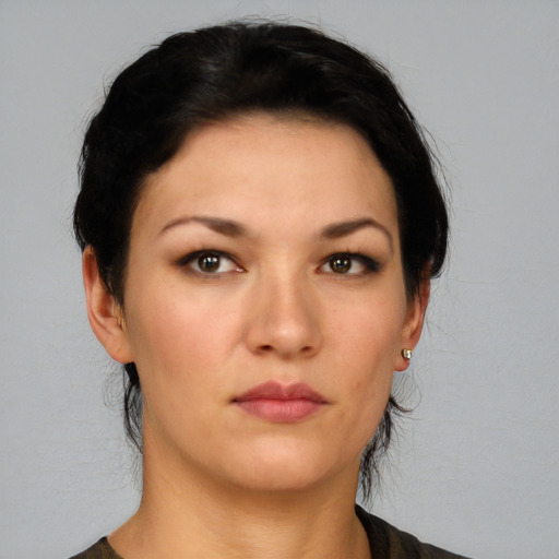Neutral white young-adult female with medium  black hair and brown eyes