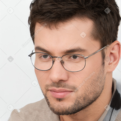 Neutral white young-adult male with short  brown hair and brown eyes