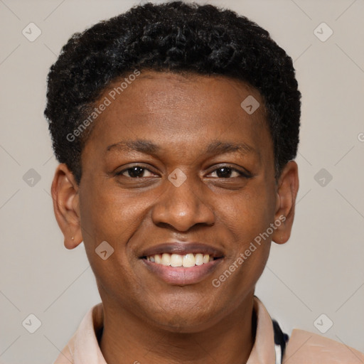 Joyful black young-adult male with short  brown hair and brown eyes