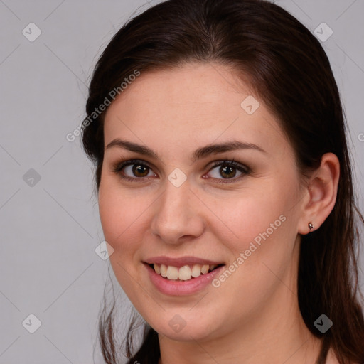 Joyful white young-adult female with medium  brown hair and brown eyes