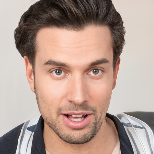 Joyful white young-adult male with short  brown hair and brown eyes