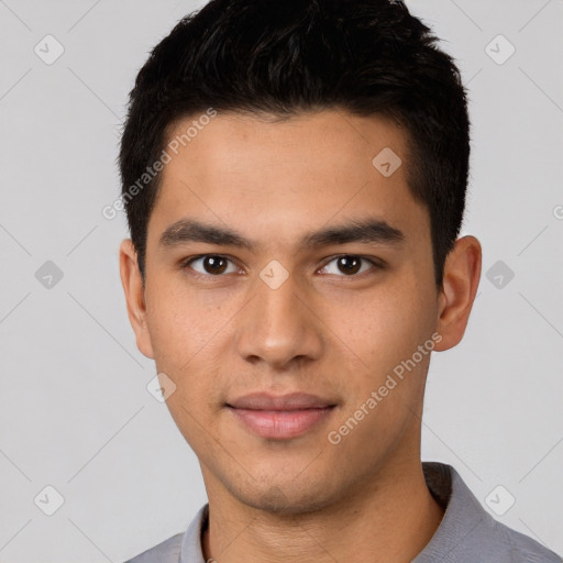 Joyful white young-adult male with short  black hair and brown eyes