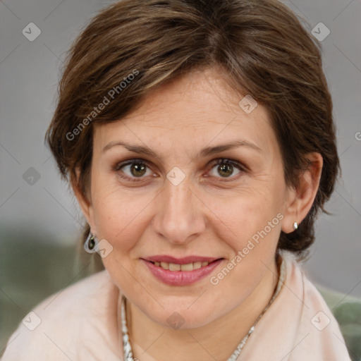 Joyful white adult female with medium  brown hair and brown eyes