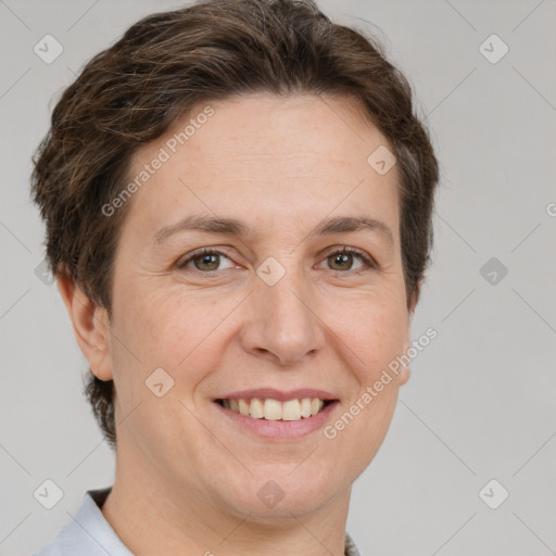 Joyful white adult female with short  brown hair and grey eyes