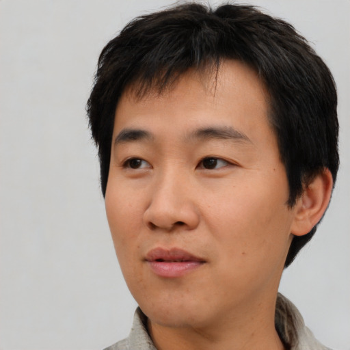 Neutral asian young-adult male with short  black hair and brown eyes