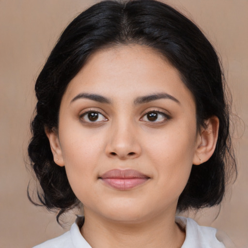 Joyful latino young-adult female with medium  black hair and brown eyes