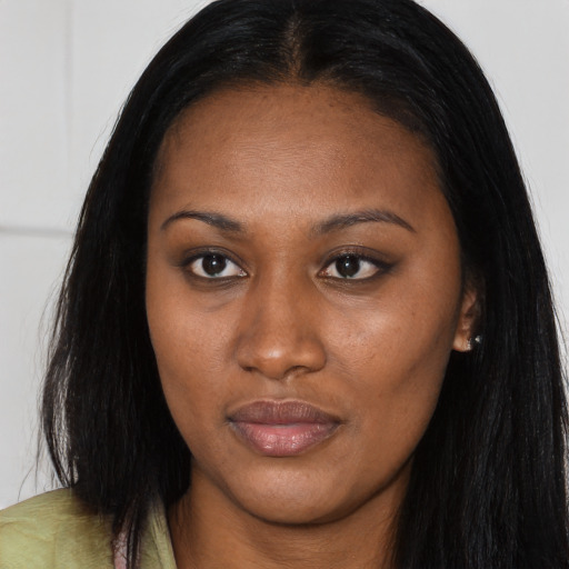 Joyful asian young-adult female with long  brown hair and brown eyes