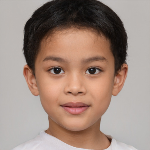 Joyful white child male with short  brown hair and brown eyes