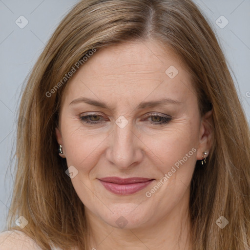 Joyful white adult female with long  brown hair and brown eyes