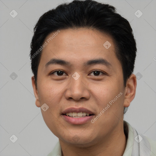 Joyful asian young-adult male with short  brown hair and brown eyes