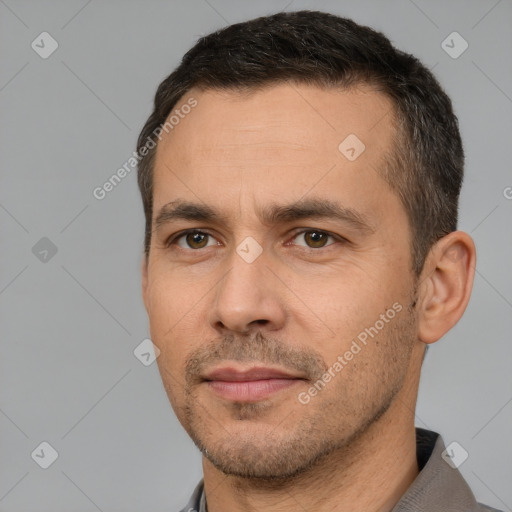 Joyful white adult male with short  brown hair and brown eyes