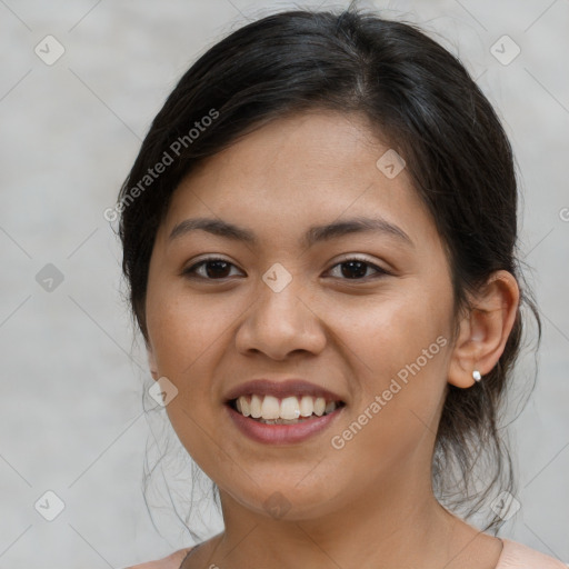 Joyful latino young-adult female with medium  brown hair and brown eyes