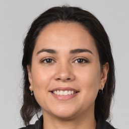 Joyful white young-adult female with medium  brown hair and brown eyes