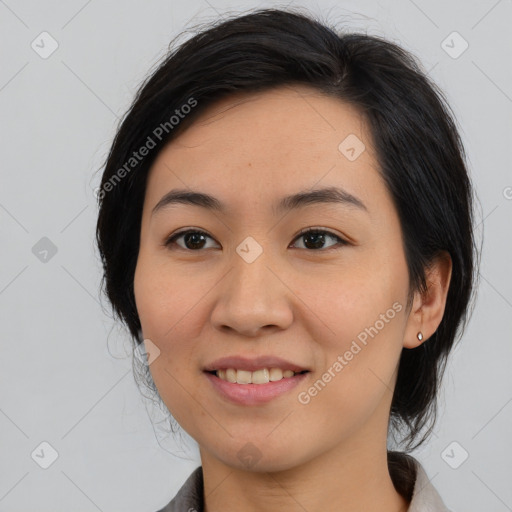 Joyful asian young-adult female with medium  black hair and brown eyes