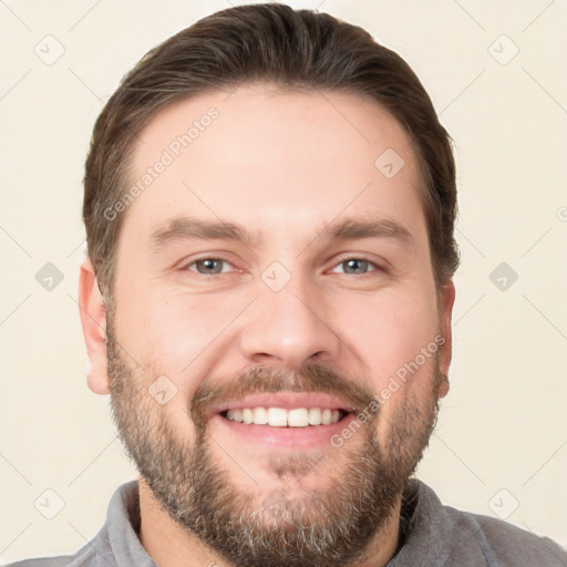 Joyful white young-adult male with short  brown hair and brown eyes