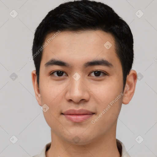 Joyful latino young-adult male with short  black hair and brown eyes