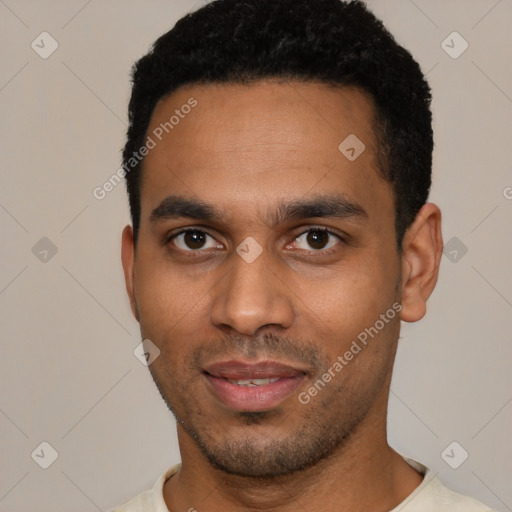 Joyful black young-adult male with short  black hair and brown eyes