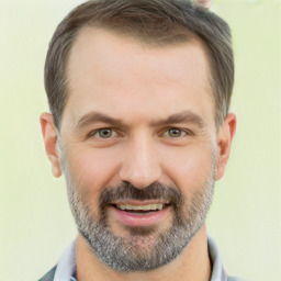 Joyful white adult male with short  brown hair and brown eyes