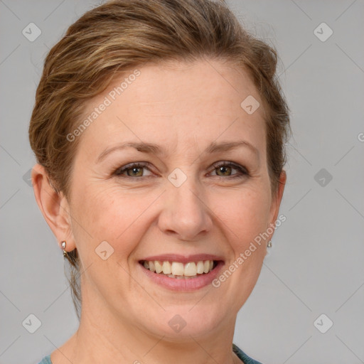 Joyful white adult female with short  brown hair and grey eyes