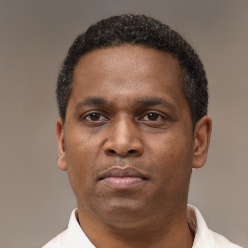 Neutral latino adult male with short  brown hair and brown eyes