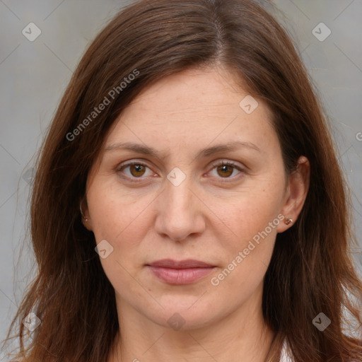 Joyful white adult female with long  brown hair and brown eyes