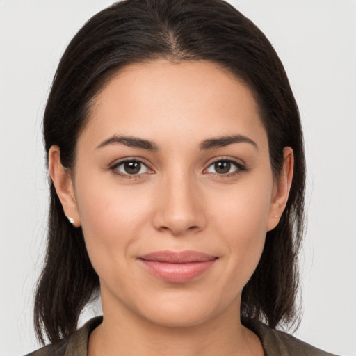 Joyful white young-adult female with medium  brown hair and brown eyes