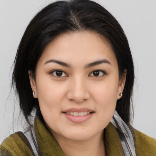 Joyful asian young-adult female with medium  brown hair and brown eyes