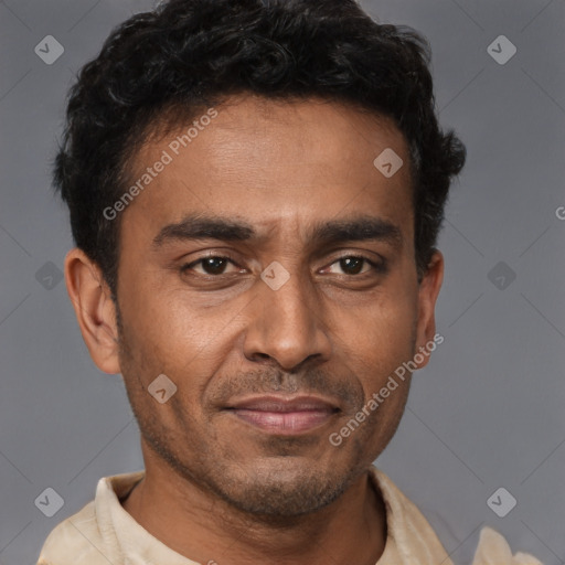 Joyful latino young-adult male with short  brown hair and brown eyes