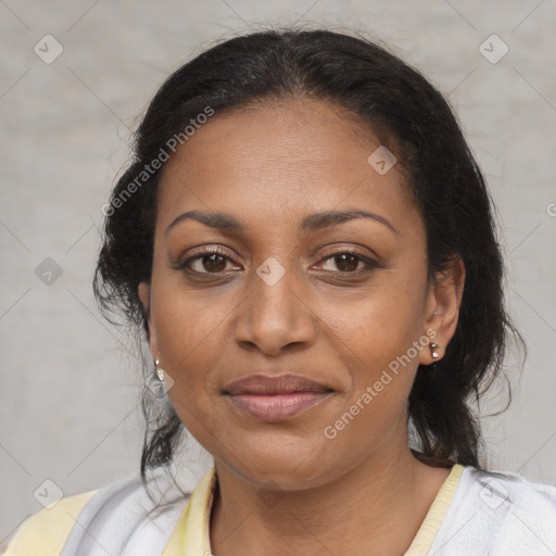 Joyful black adult female with medium  brown hair and brown eyes