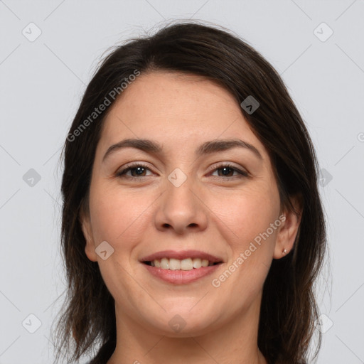 Joyful white adult female with medium  brown hair and brown eyes