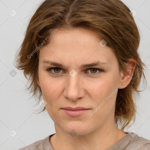 Joyful white young-adult female with medium  brown hair and blue eyes