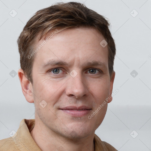 Joyful white adult male with short  brown hair and grey eyes