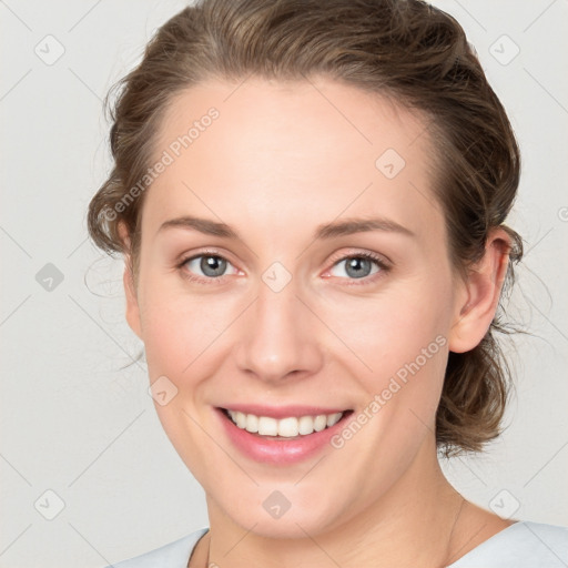 Joyful white young-adult female with medium  brown hair and blue eyes