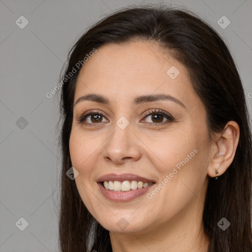 Joyful white young-adult female with long  brown hair and brown eyes