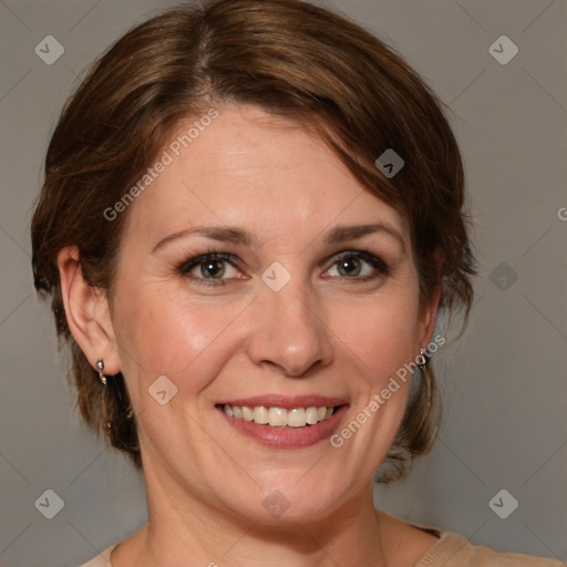 Joyful white adult female with medium  brown hair and grey eyes