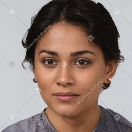 Joyful latino young-adult female with short  brown hair and brown eyes