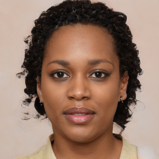 Neutral black young-adult female with medium  black hair and brown eyes