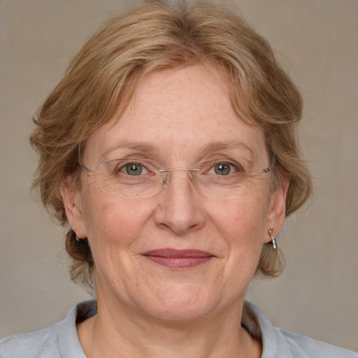 Joyful white middle-aged female with medium  brown hair and blue eyes