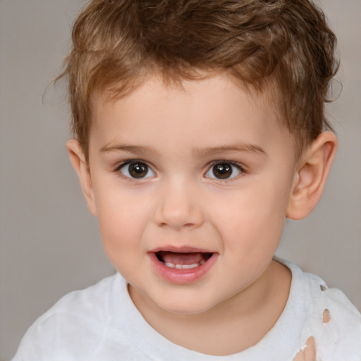 Joyful white child male with short  brown hair and brown eyes