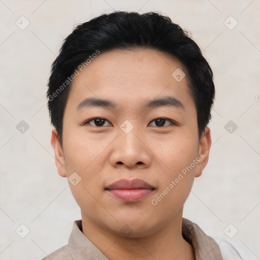 Joyful asian young-adult male with short  black hair and brown eyes