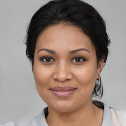 Joyful latino young-adult female with medium  black hair and brown eyes