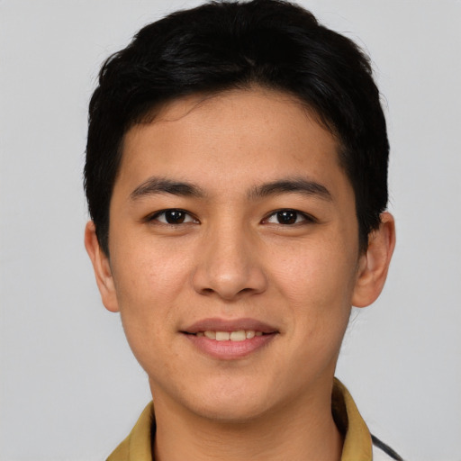 Joyful asian young-adult male with short  brown hair and brown eyes