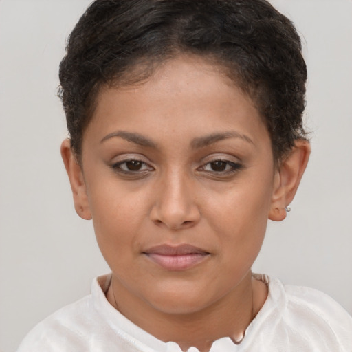 Joyful black young-adult female with short  brown hair and brown eyes