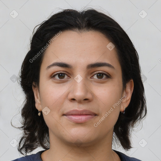 Joyful latino young-adult female with medium  brown hair and brown eyes